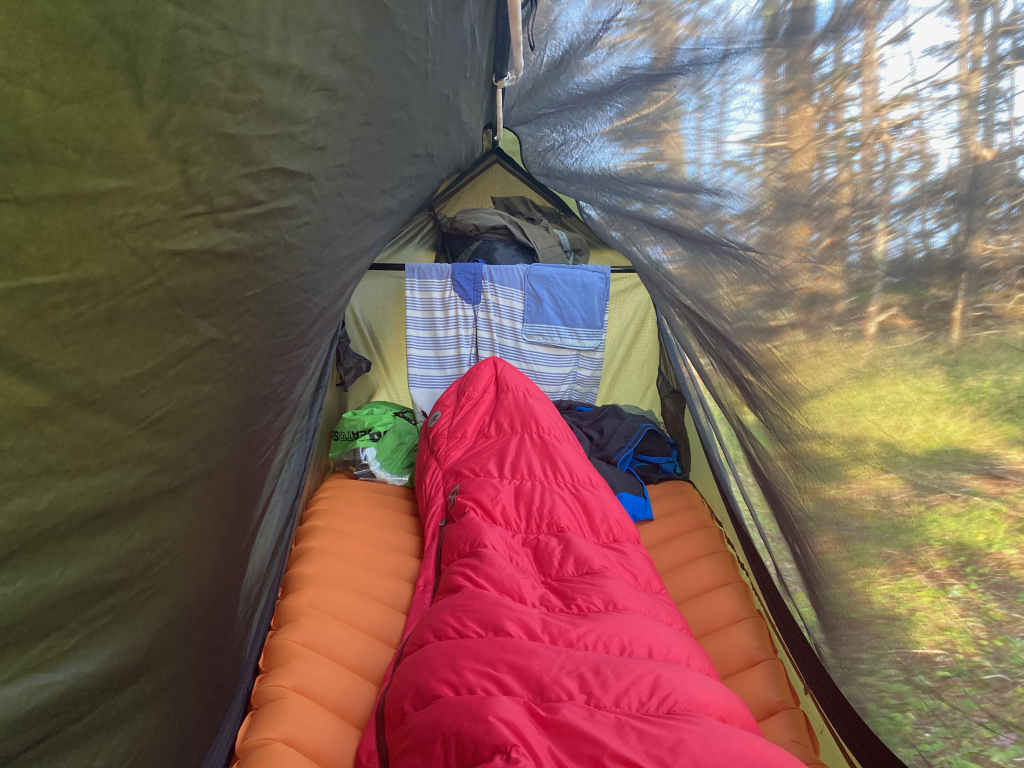 The view from inside the Haven XL through the bug mesh with the fly to one side.